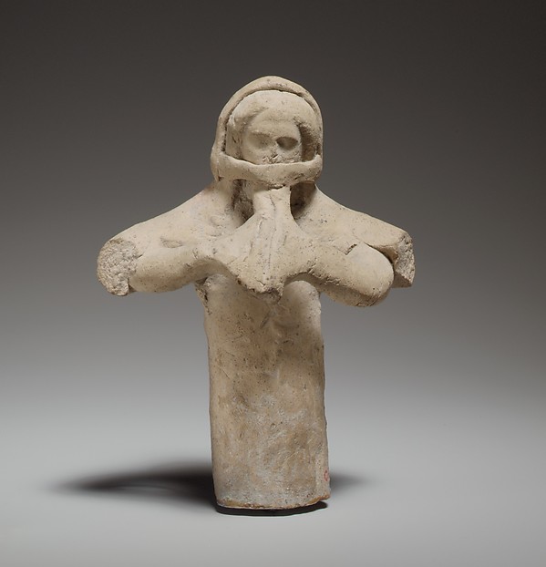 Standing female flute player