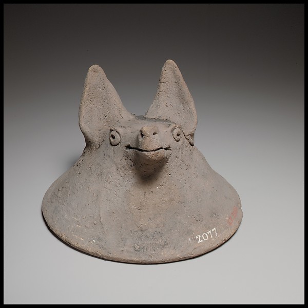 Terracotta mask in the shape of the head of a fox, dog, or bat by an unrecorded maker, The Metropolitan Museum of Art