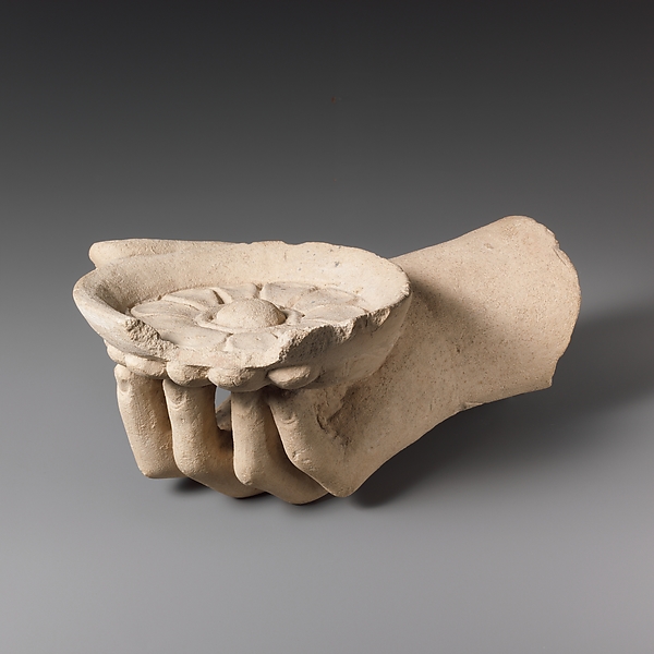Limestone hand holding a phiale (libation bowl) by an unrecorded maker, The Metropolitan Museum of Art