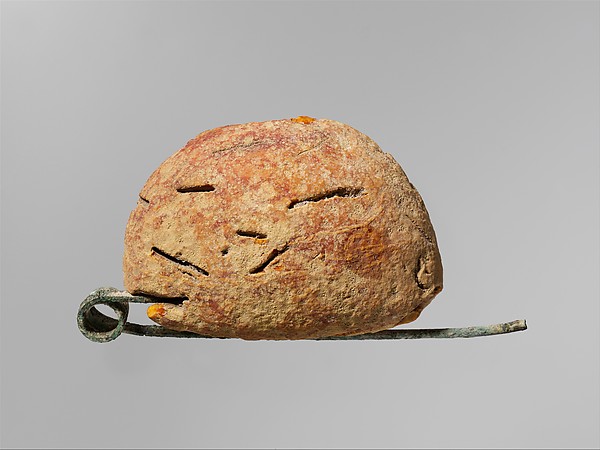 Bronze and amber fibula (safety pin) by an unrecorded maker, The Metropolitan Museum of Art