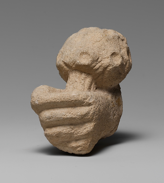 Limestone statue fragment of a left hand holding a bunch of daisies by an unrecorded maker, The Metropolitan Museum of Art
