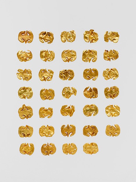 Thirty-four gold dress ornaments