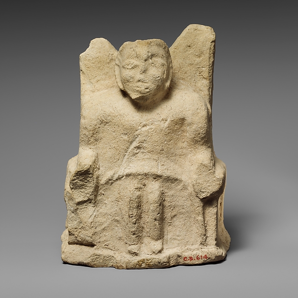 Limestone statuette of a seated Zeus Ammon