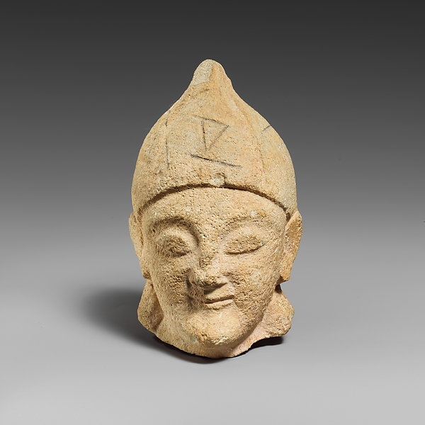 Limestone head of a beardless male with a helmet of Greek type by an unrecorded maker, The Metropolitan Museum of Art