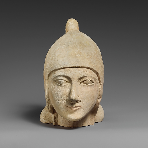 Limestone head of a beardless male wearing a conical helmet by an unrecorded maker, The Metropolitan Museum of Art