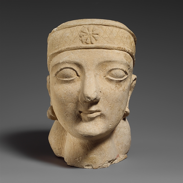 Limestone head of a beardless male with a diadem