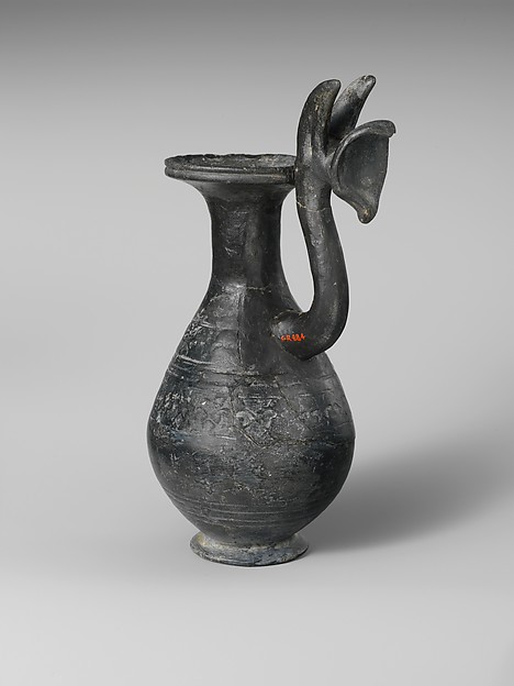 Terracotta jug with griffin protome handle