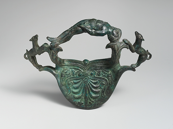 Bronze handle with dogs flanking a reclining youth by an unrecorded maker, The Metropolitan Museum of Art