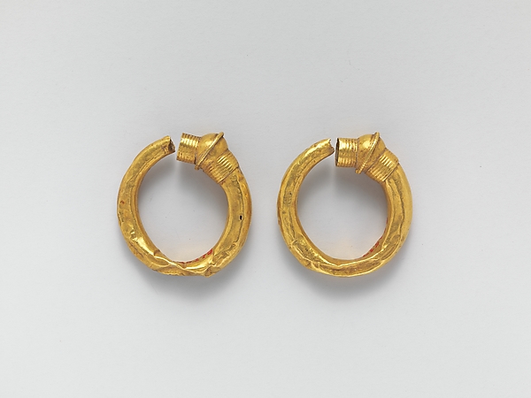 Gold trumpet-shaped earrings