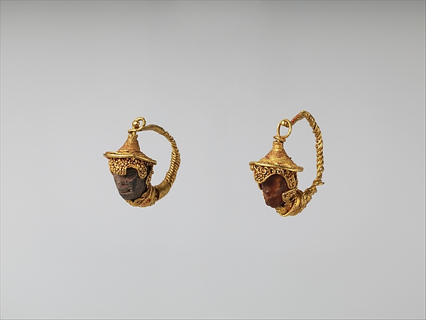 Gold and amber earrings with head of a Black African youth by an unrecorded maker, The Metropolitan Museum of Art
