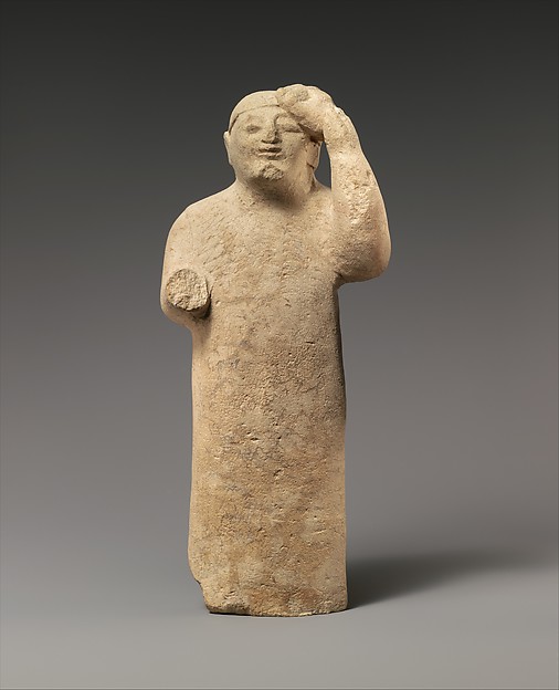 Limestone figure holding a mask, probably late 6th century BCE