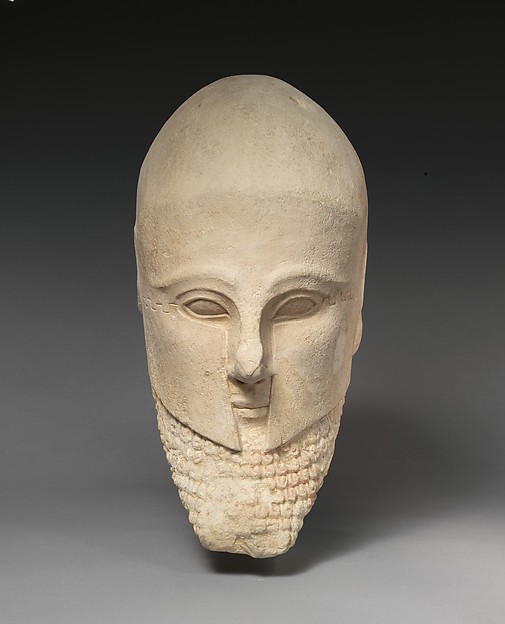 Limestone bearded head with a Corinthian helmet, early 5th century BCE