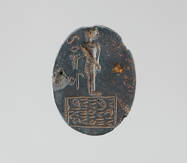 Haematite intaglio: Youth on inscribed stele