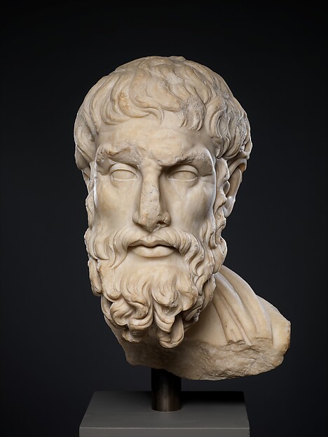 The Met, CC0 Roman marble head of the philosopher Epikouros, bearded and turned slightly aside, lit from the left against a dark ground