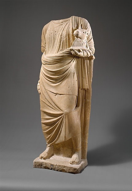 Limestone statue of a man holding a mask in the form of a bull's head by an unrecorded maker, The Metropolitan Museum of Art