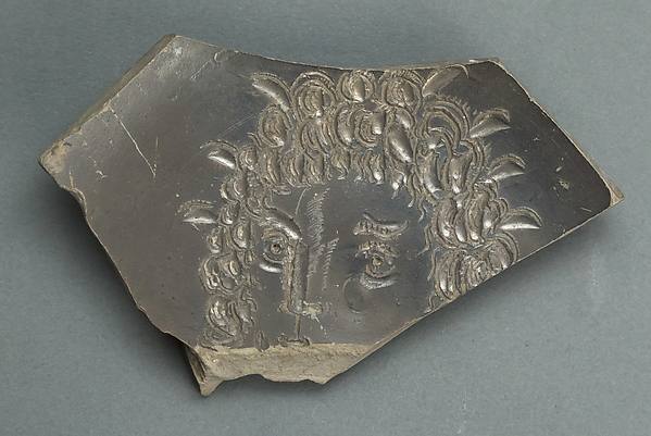 Plate with face, fragmentary by an unrecorded maker, The Metropolitan Museum of Art