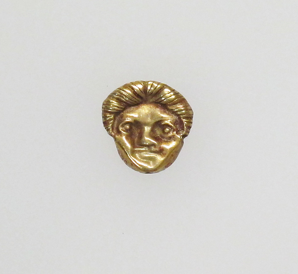 Appliqué in the form of a head