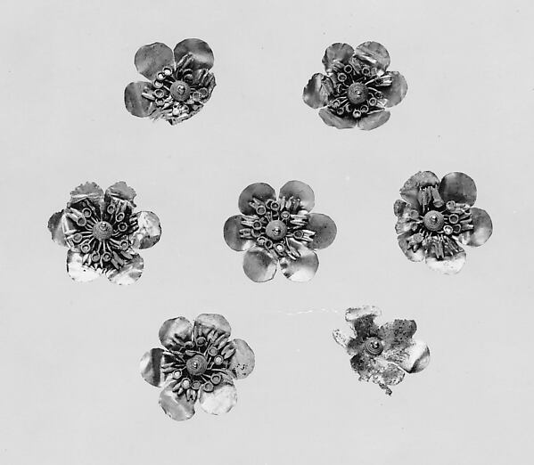 Seven gold rosettes