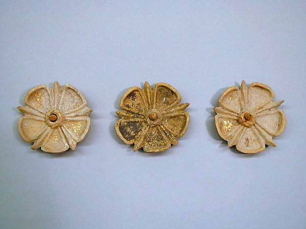 Three gilded terracotta appliqués