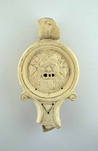 Terracotta lamp in the form of a satyr's mask by an unrecorded maker, The Metropolitan Museum of Art