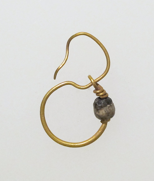 Earring, delta-shaped