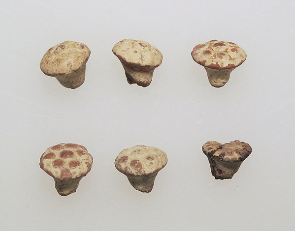 Pendant of gilded clay