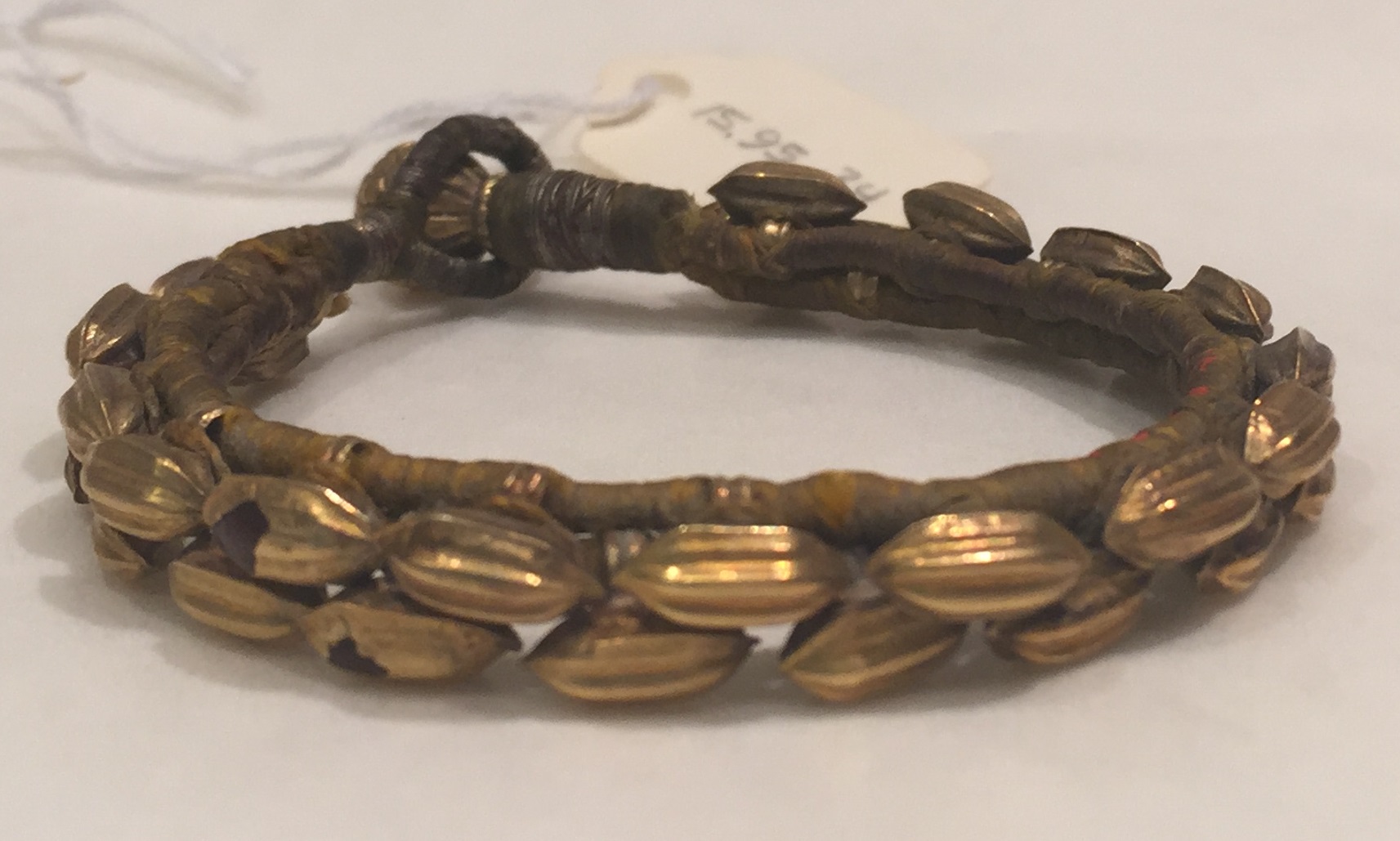 Pahunchi bracelet with seed-shaped beads, gold and silk, nineteenth century, Northern India; The Met, accession 15.95.34, public-domain photograph. This museum object is not a Hansuli product or an identified Uttarakhand family heirloom.