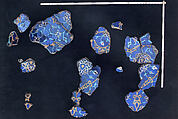 A Group of Mosaic Tilework Fragments, Stonepaste; polychrome glazed tiles, set into clay
