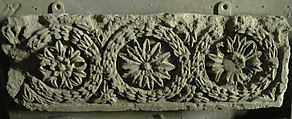 Fragment of a Frieze with a Sequence of Roundels Enclosing Rosettes, Limestone; carved in relief