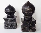 Two Black Stone Carpet Weights, Stone