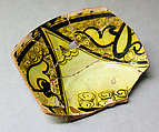 Fragment of a Bowl, Earthenware; reddish body with white slip and black decoration under yellow glaze