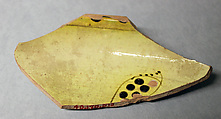 Fragment of a Bowl, Earthenware; reddish body, white slip with yellow-black and brown-black decoration under glaze