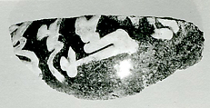 Fragment of a Jar, Earthenware; dark buff body, white slip on black ground under glaze