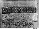Sleeve Fragment with a Band Decorated with an Animal, Tapestry weave in red wool (dyed with madder) and undyed linen on plain-weave ground of undyed linen; details in flying shuttle in undyed linen; weft loop pile with undyed linen