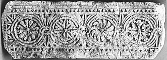 Fragment of a Frieze with Medallions, Limestone; carved