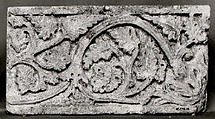 Fragment of a Frieze with Vine Scrolls Bearing Grapes, Limestone; carved in relief