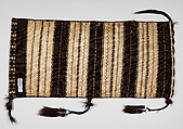 Saddle Bag, Loom-woven flat weave cloth in wool folded and joined at the sides with overcast stitches faces of different pattern; decorated with braids