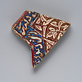 Fragment of a Star-Shaped Tile, Stonepaste; glazed and luster-painted