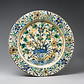 Dish, Stonepaste; underglaze painted in black, blue, and green with red slip