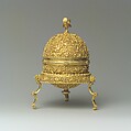 Goa Stone and Gold Case, Container: gold; pierced, repoussé, with cast legs and finials
Goa stone: compound of organic and inorganic materials