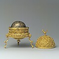 Goa Stone and Gold Case, Container: gold; pierced, repoussé, with cast legs and finials
Goa stone: compound of organic and inorganic materials