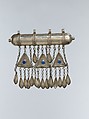 Amulet Holder, Silver; gallery wired and twisted wire decoration with glass stones, silver link chains and embossed pendants.
