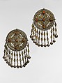 Pectoral Disc Ornament, One of a Pair, Silver with gilt applied decoration, openwork, decorative wire, connecting links with applied decoration, cone shaped and spherical bells, and table cut carnelians