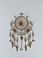 Pectoral Disc Ornament, Silver, with decorative wire, embossed pendants, ram's-head terminals, loop-in-loop chains, conical bells, and table-cut carnelians