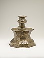 Candlestick with Figural Imagery, Brass; cast, engraved, and inlaid with silver and black compound