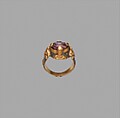 Ring, Gold; cast and fabricated from sheet, decorated with bitumen-highlighted incising, set with tourmaline bead