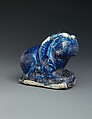 Bath Scraper in the Shape of a Lion, Stonepaste; molded, incised, glazed in transparent blue