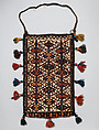 Spindle Bag, Wool (warp, sumak weft, pile, and tassels), cotton (ground weft and tassels), goat(?) hair (side finishes and tassels), metal rings, braided strap, and faience beads (tassels); weft-faced plain weave with pattern in sumak extra-weft wrapping (front and back); symmetrically knotted pile (bottom edge)