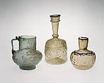Bottle with Impressed Decorations, Glass, greenish yellow; blown in two parts, impressed with tongs, applied blue rim