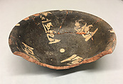 Bowl, Earthenware; purplish- brown slip with slip decoration under transparent glaze